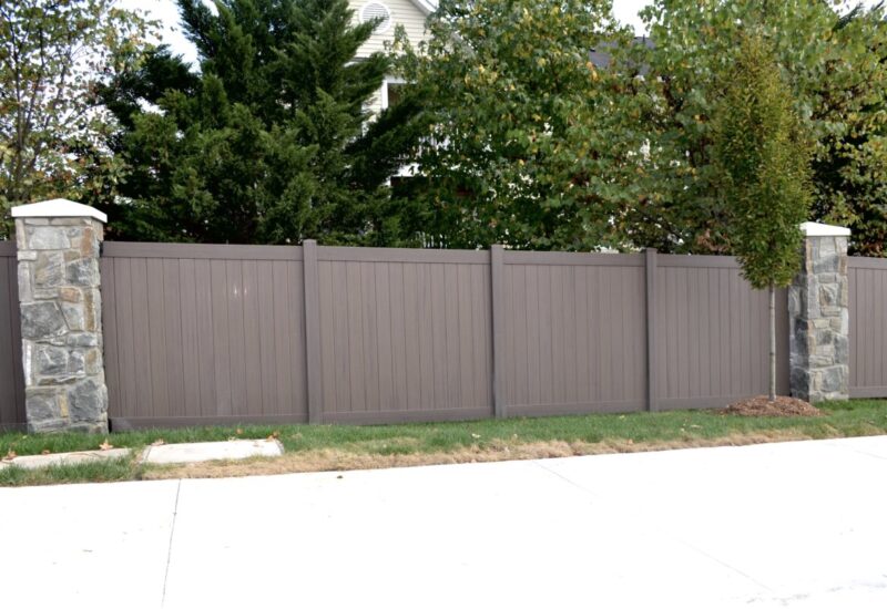 Caroline Dark Walnut Caroline mounted between stone pillars